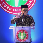 Mendikdasmen RI Prof Abdul Mu'ti menyampaikan sambutan dalam Peringatan HUT Ke-79 PGRI, Sabtu (14/12/2024). (Foto:Ubay)